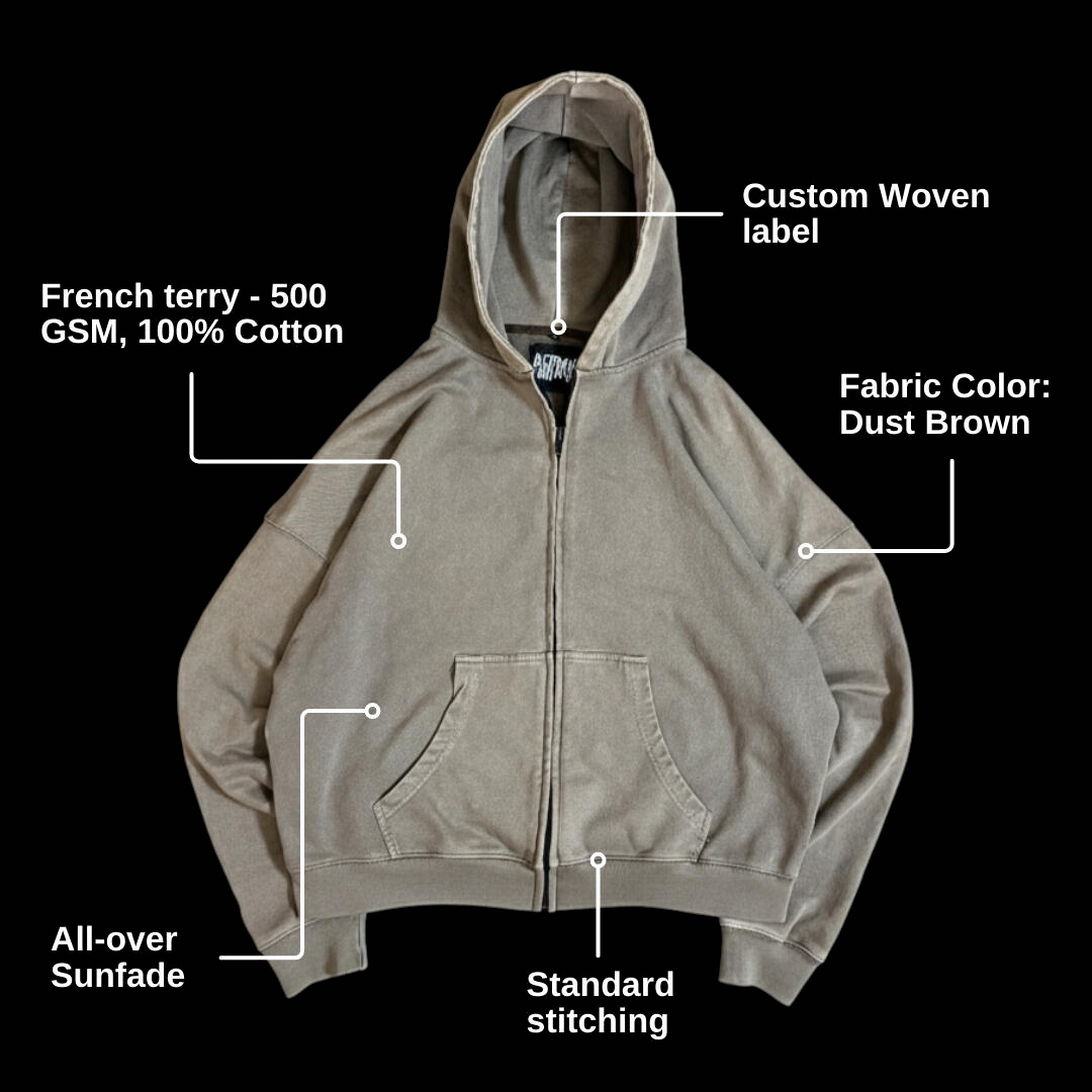 Dust brown zip hoodie, annotated: custom woven label, all-over sun fade, standard stitching, 500 GSM cotton french terry